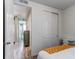 Bedroom features a bright entrance to the bath, with a closet and neutral tones at 39167 Braxton Ln, Elizabeth, CO 80107
