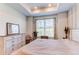 Serene bedroom featuring tray ceiling, natural light, and a calm, neutral color palette at 39167 Braxton Ln, Elizabeth, CO 80107