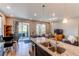 Spacious open-concept kitchen with an island, dining area, and living room view at 39167 Braxton Ln, Elizabeth, CO 80107