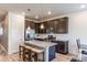 Modern kitchen featuring stainless steel appliances, granite countertops, and a center island at 39167 Braxton Ln, Elizabeth, CO 80107