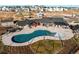 Aerial view of the community clubhouse with swimming pool, lounging spaces, and recreational amenities at 39167 Braxton Ln, Elizabeth, CO 80107