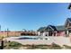 Community pool with shaded seating areas and a clear blue sky in the background at 39167 Braxton Ln, Elizabeth, CO 80107