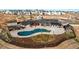 Exterior view of the community pool, clubhouse and surrounding neighborhood at 39167 Braxton Ln, Elizabeth, CO 80107