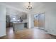 Bright kitchen featuring stylish gray cabinets, stainless steel appliances, and a breakfast bar at 4542 S Quintero St, Aurora, CO 80015