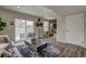 Finished basement area with a sliding glass door to the backyard and comfortable seating at 1158 Sugarloaf Ln, Erie, CO 80516