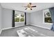 A peaceful bedroom with large windows offering plenty of natural light and pleasant outdoor views at 3612 Hudson St, Denver, CO 80207