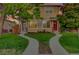 Charming duplex featuring well-manicured lawns, divided walkways and inviting entryways at 3612 Hudson St, Denver, CO 80207