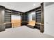 Spacious home office with custom built-in shelving, cabinets, and a convenient workspace at 3612 Hudson St, Denver, CO 80207