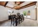 Bright dining room with wood ceiling, view of backyard, and seating for six at 7192 W 67Th Pl, Arvada, CO 80003