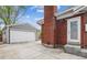 Detached two-car garage with painted siding, offering ample parking and storage space at 7192 W 67Th Pl, Arvada, CO 80003