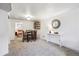 Open living room showcasing a dining set, shelving, and an adjacent bedroom at 7192 W 67Th Pl, Arvada, CO 80003