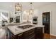 Open kitchen design with marble countertops, a gas cooktop, custom lighting, and stainless steel appliances at 918 Dakota Dr, Castle Rock, CO 80108