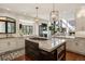 Gourmet kitchen with a marble island, stainless steel appliances, custom cabinets, and great natural light at 918 Dakota Dr, Castle Rock, CO 80108