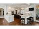 Spacious kitchen featuring two islands, stainless steel appliances, custom cabinetry, and modern lighting at 918 Dakota Dr, Castle Rock, CO 80108