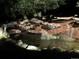 Night view of a beautifully lit water feature at 918 Dakota Dr, Castle Rock, CO 80108