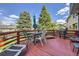 Outdoor deck with patio furniture, perfect for relaxing and enjoying the backyard view at 3680 S Gibralter Cir, Aurora, CO 80013