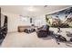 Finished basement with seating, decor, and fitness equipment provides ample space for recreation at 3680 S Gibralter Cir, Aurora, CO 80013