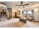 Inviting living room featuring neutral tones, comfortable seating, and ample natural light from the window at 3680 S Gibralter Cir, Aurora, CO 80013