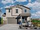 Charming two-story home with a covered front porch, neutral siding and a two-car garage at 903 W Beverly St, Elizabeth, CO 80107