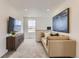 Cozy living area with comfortable seating, a TV, and a stylish accent wall at 903 W Beverly St, Elizabeth, CO 80107