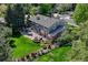 Aerial view of beautifully landscaped backyard with patio, fire pit, and plenty of greenery at 10289 E Berry Dr, Greenwood Village, CO 80111