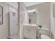 Bathroom featuring a shower, vanity, and low-flow toilet at 10289 E Berry Dr, Greenwood Village, CO 80111