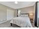 Comfortable bedroom with gray walls, carpet and a queen-sized bed with white linens at 10289 E Berry Dr, Greenwood Village, CO 80111