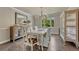 Elegant dining room with stylish chandelier, hardwood floors, and decorative cabinet, perfect for entertaining at 10289 E Berry Dr, Greenwood Village, CO 80111