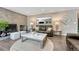 Comfortable living room features a stone fireplace, a leather sofa, and a marble top coffee table at 10289 E Berry Dr, Greenwood Village, CO 80111
