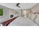 Inviting main bedroom with a stone fireplace, natural light, and comfortable carpet flooring at 10289 E Berry Dr, Greenwood Village, CO 80111