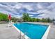 Relaxing pool area with diving board, lifeguard stand, and many lounge chairs to soak up the summer sun at 10289 E Berry Dr, Greenwood Village, CO 80111