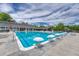 Large community pool featuring lifeguard chairs and plenty of seating with shade perfect for families at 10289 E Berry Dr, Greenwood Village, CO 80111