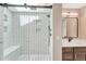 Contemporary shower with frameless glass, detailed tile, and built-in shower seat at 10289 E Berry Dr, Greenwood Village, CO 80111