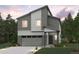 Striking two-story home with attached two car garage, modern design, and manicured landscaping at 19069 E 94Th Pl, Commerce City, CO 80022