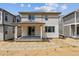 Back of house featuring a covered patio and slider with an unfinished yard at 9266 Telluride Ct, Commerce City, CO 80022