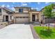 Beautiful two-story home featuring a two car garage and stone pillar accents at 9266 Telluride Ct, Commerce City, CO 80022