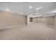 Spacious basement boasting neutral-colored walls and carpet and a window with blinds at 4545 S Monaco St # 243, Denver, CO 80237