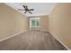 Minimalist bedroom with natural light and carpeted floors, creating a peaceful retreat at 4545 S Monaco St # 243, Denver, CO 80237