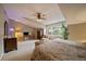 Spacious bedroom features a neutral color scheme, bright windows, and decorative ceiling fan at 4545 S Monaco St # 243, Denver, CO 80237