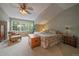 Spacious bedroom featuring bright windows, a neutral color scheme, and a decorative ceiling fan at 4545 S Monaco St # 243, Denver, CO 80237