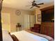 This bedroom boasts natural lighting, an entertainment center, and a cozy atmosphere at 4545 S Monaco St # 243, Denver, CO 80237
