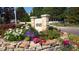 Stone monument displaying '4545' address with colorful flowerbeds at 4545 S Monaco St # 243, Denver, CO 80237