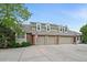 Exterior of a home featuring a three-car garage and beautiful brick and siding at 4545 S Monaco St # 243, Denver, CO 80237