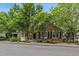 Charming brick and siding home featuring lush landscaping and a welcoming entrance at 4545 S Monaco St # 243, Denver, CO 80237