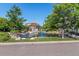 Scenic view of a gazebo on a pond, surrounded by lush greenery and landscaping in a tranquil setting at 4545 S Monaco St # 243, Denver, CO 80237