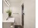 Bright bathroom featuring a white vanity with modern fixtures and ample storage at 9221 High St, Thornton, CO 80229