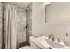 Updated bathroom with tiled shower, modern fixtures, and sleek vanity for a spa-like feel at 9221 High St, Thornton, CO 80229