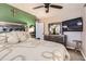 This bedroom boasts a ceiling fan, TV, and decorative accents for a comfortable space at 9221 High St, Thornton, CO 80229
