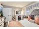 Cozy bedroom with a vanity table, and tufted upholstered headboard at 9221 High St, Thornton, CO 80229