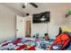 Fun bedroom with a TV, ceiling fan, and Spiderman themed comforter at 9221 High St, Thornton, CO 80229